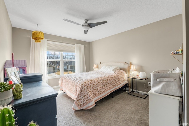 carpeted bedroom featuring a textured ceiling, ceiling fan, and baseboards