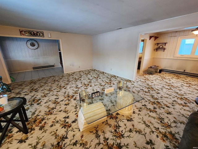 living area with a baseboard radiator, tile patterned flooring, and visible vents