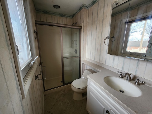 full bathroom with toilet, tile patterned flooring, vanity, and a shower stall