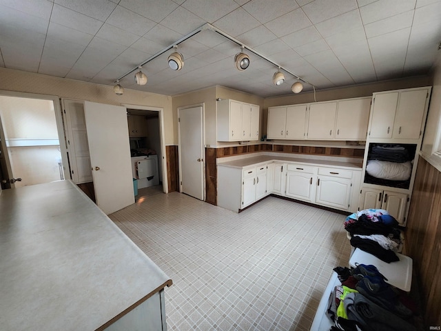 kitchen with light countertops and white cabinets