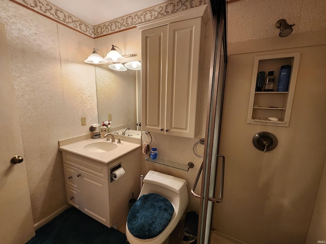 bathroom featuring toilet and vanity