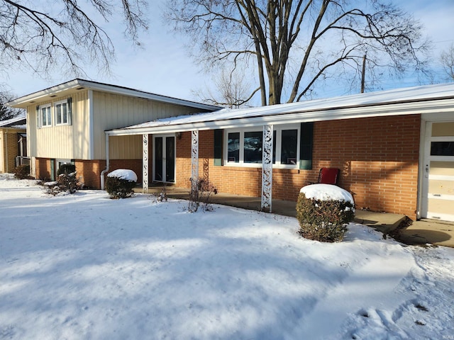 view of front of home featuring brick siding