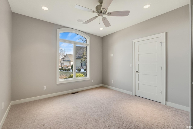 unfurnished room featuring recessed lighting, baseboards, visible vents, and light colored carpet