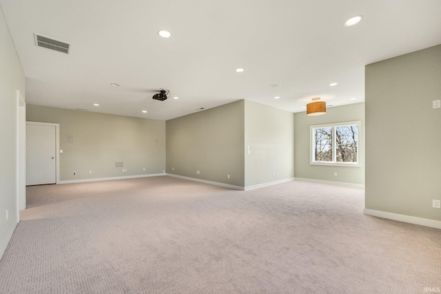 unfurnished room featuring recessed lighting, visible vents, baseboards, and light colored carpet