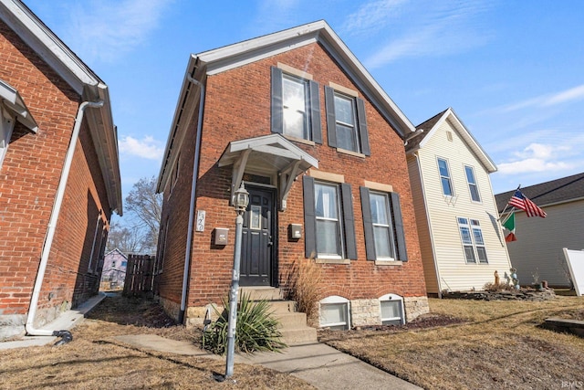 traditional-style home with brick siding