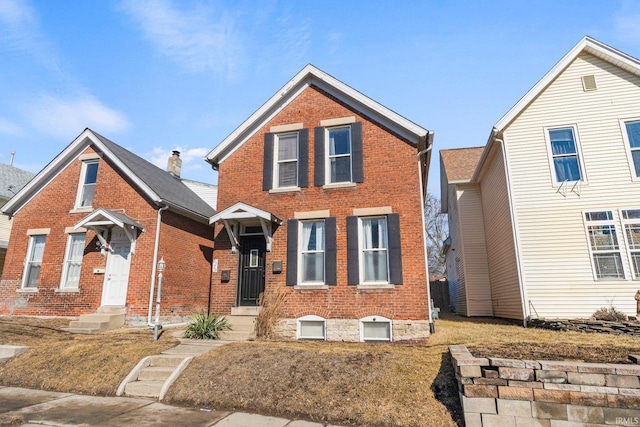 traditional-style home featuring brick siding