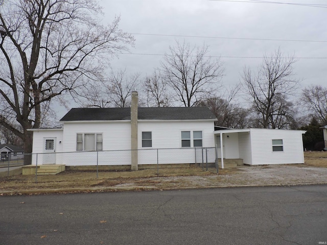 view of front of house featuring fence