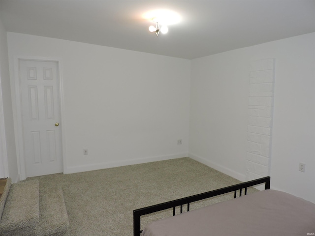 bedroom with baseboards and carpet flooring