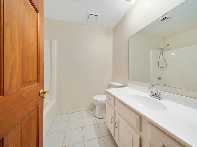 bathroom with tile patterned flooring, toilet, vanity, baseboards, and  shower combination