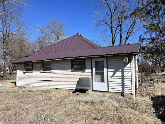 back of property with metal roof