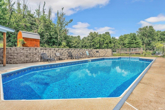 view of pool with fence and a fenced in pool