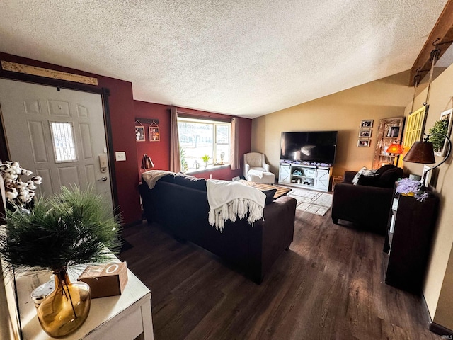 living area featuring vaulted ceiling, a textured ceiling, and wood finished floors