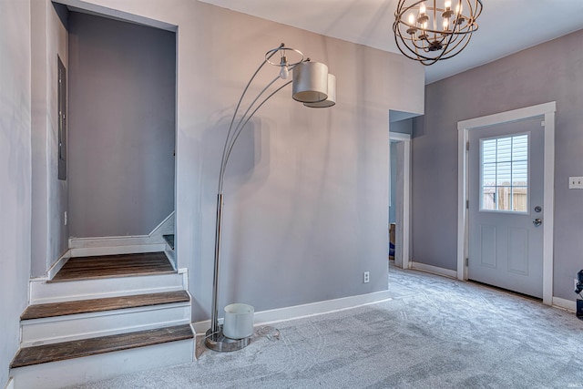 entrance foyer featuring light carpet, stairway, baseboards, and a notable chandelier