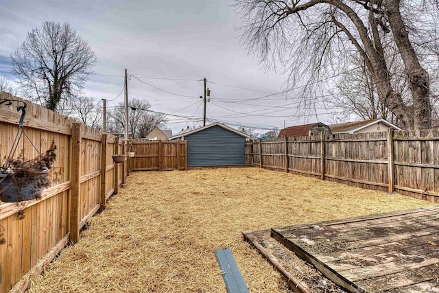 view of yard featuring an outbuilding and a fenced backyard