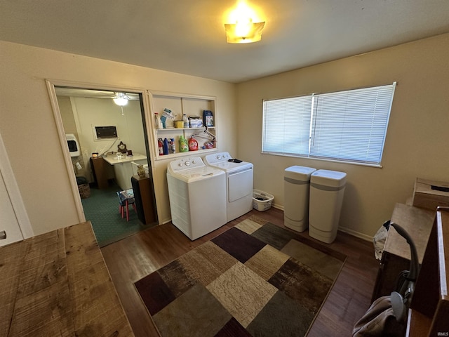 laundry area featuring laundry area, baseboards, dark wood-style floors, and independent washer and dryer