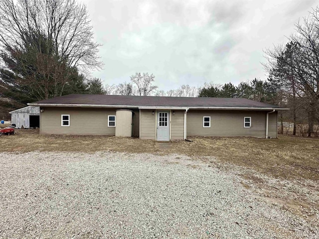 exterior space with gravel driveway