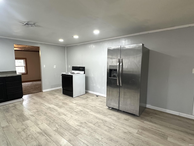 kitchen featuring light wood finished floors, stainless steel fridge, electric range, baseboards, and crown molding