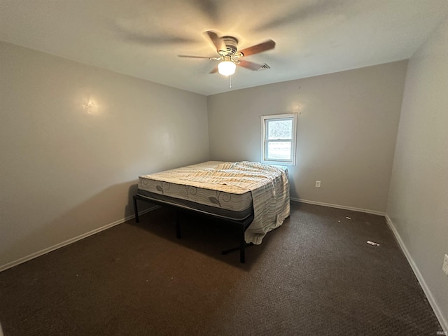 bedroom featuring ceiling fan, baseboards, and dark colored carpet