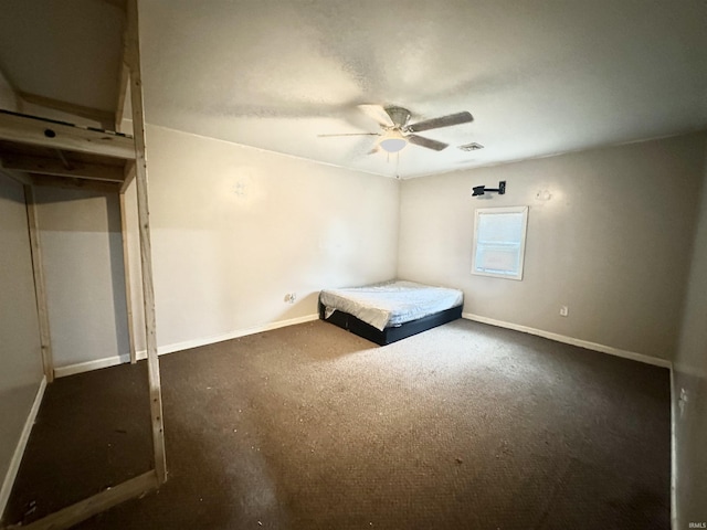 unfurnished bedroom with baseboards, visible vents, and ceiling fan