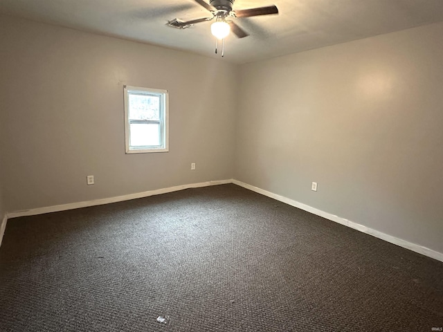 empty room with a ceiling fan, visible vents, baseboards, and carpet flooring