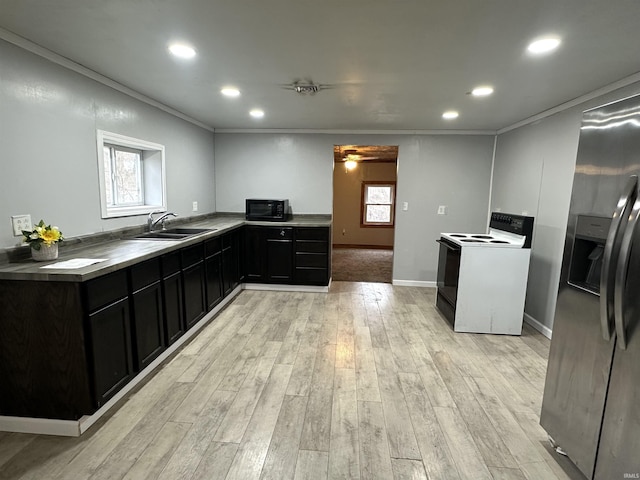 kitchen featuring electric stove, crown molding, a sink, black microwave, and stainless steel fridge with ice dispenser