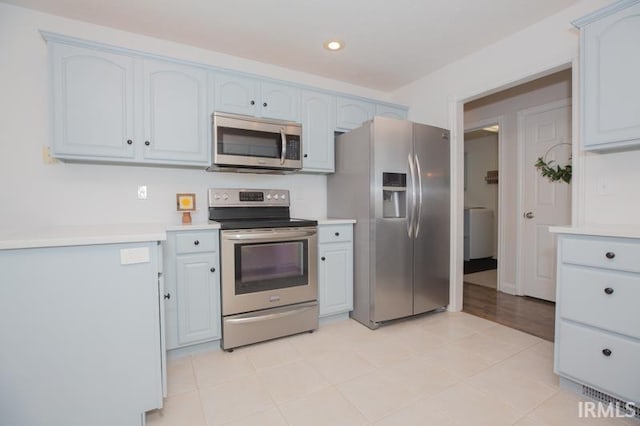 kitchen with light countertops, appliances with stainless steel finishes, and recessed lighting