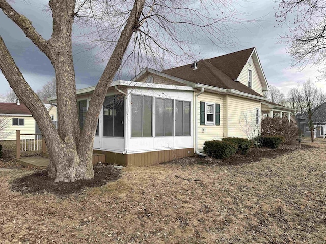 rear view of house with a sunroom