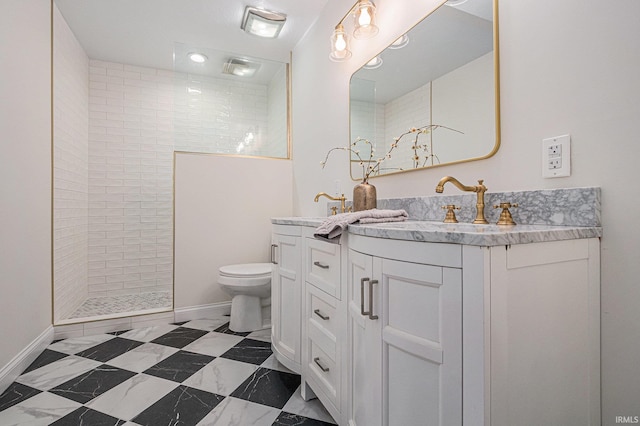 full bath with double vanity, toilet, a sink, a walk in shower, and baseboards