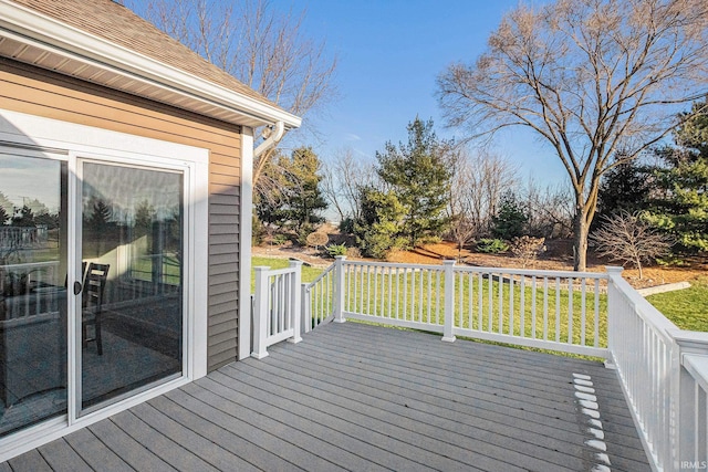 wooden terrace with a yard