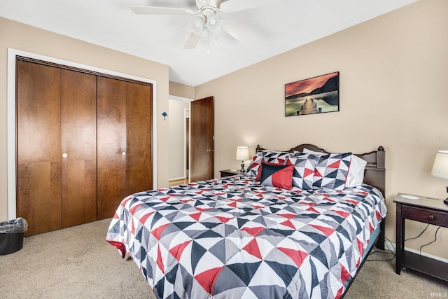 carpeted bedroom featuring a closet and ceiling fan