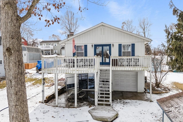 view of front of home featuring a garage and stairs