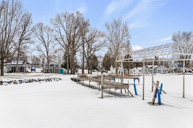 view of home's community featuring playground community and a residential view