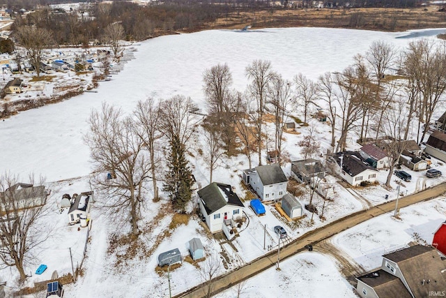 snowy aerial view with a residential view