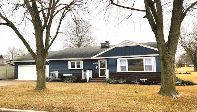 view of front of house featuring an attached garage, a shingled roof, driveway, board and batten siding, and a chimney