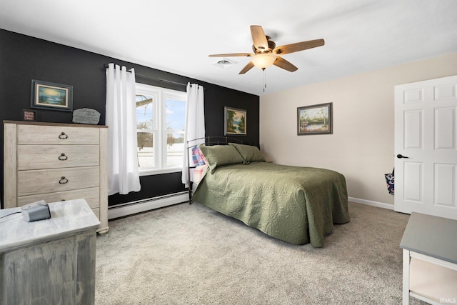 bedroom with baseboards, baseboard heating, visible vents, and light colored carpet