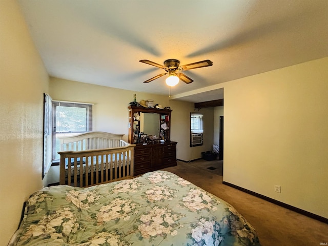 carpeted bedroom with cooling unit, ceiling fan, and baseboards