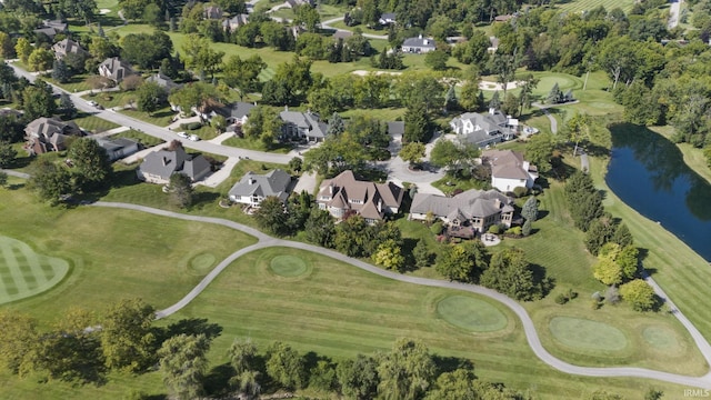 aerial view featuring a residential view, a water view, and golf course view