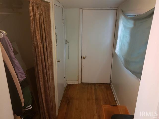 hallway featuring wood finished floors