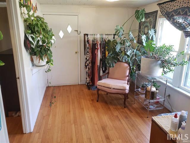 interior space with a wealth of natural light and hardwood / wood-style flooring