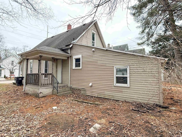 exterior space featuring a chimney