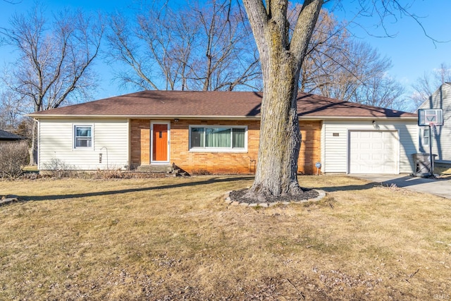 ranch-style house featuring a garage, a front yard, concrete driveway, and brick siding