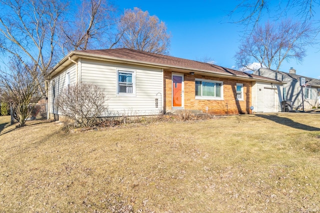 ranch-style home with an attached garage, brick siding, driveway, and a front yard