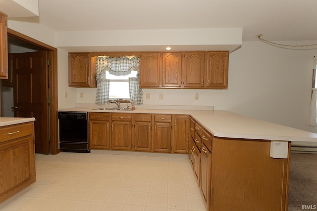 kitchen with a peninsula, black dishwasher, light countertops, and a sink