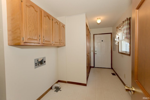 laundry room with light floors, washer hookup, cabinet space, and baseboards