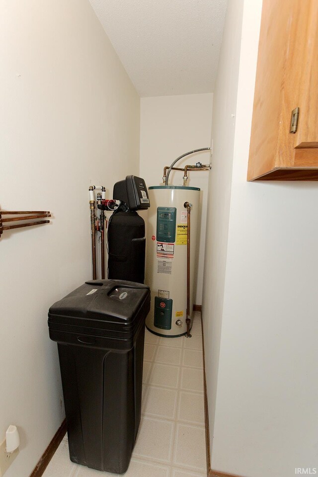 utility room featuring water heater