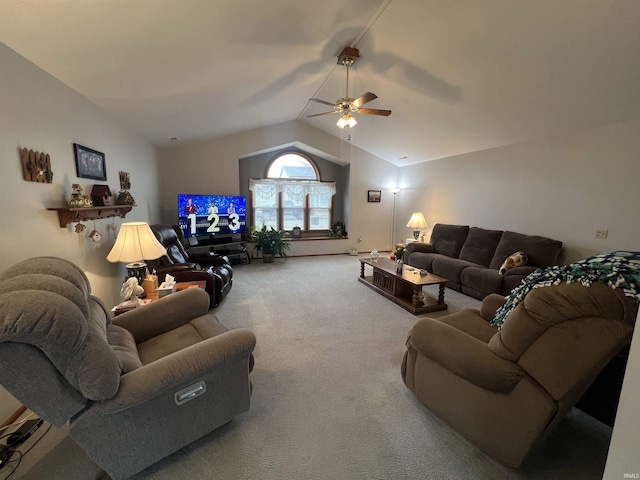 carpeted living area featuring vaulted ceiling and a ceiling fan