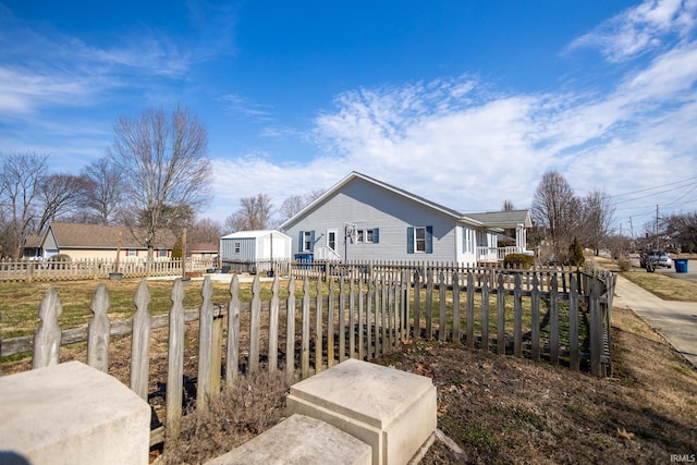 view of home's exterior with a fenced front yard