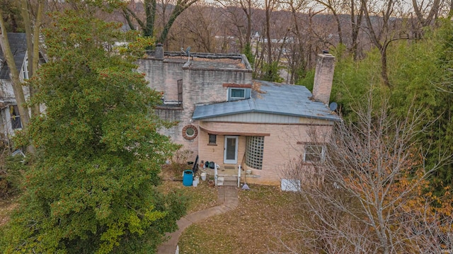 view of front facade with a chimney