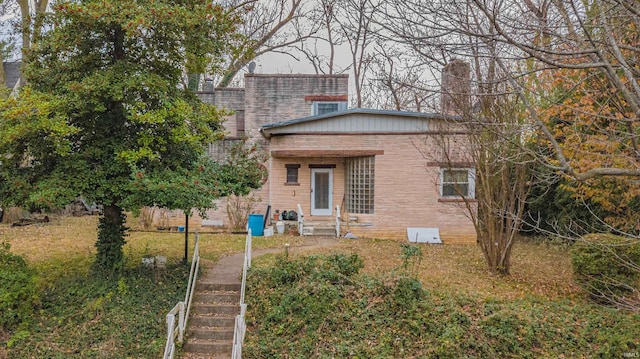 view of front of home with brick siding