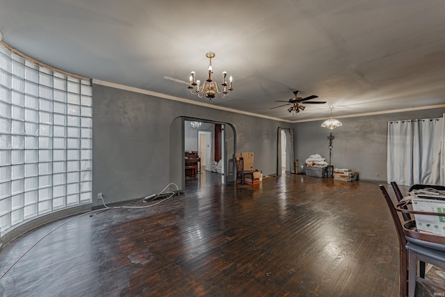 interior space with crown molding, arched walkways, wood finished floors, and ceiling fan with notable chandelier